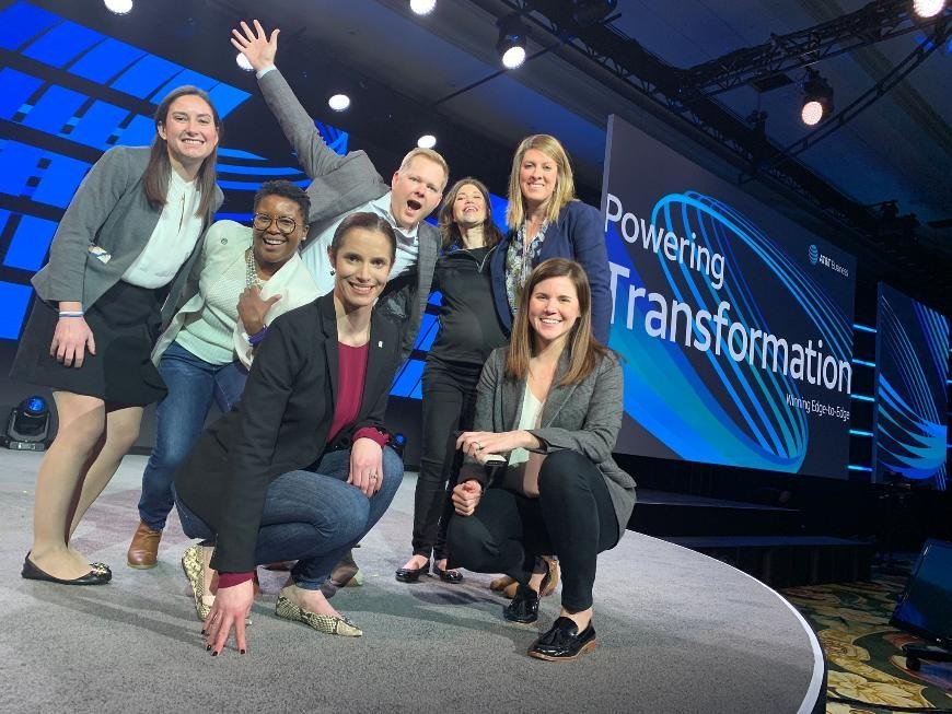 Mike with colleagues on stage at an AT&T Business event